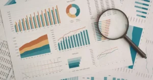 Magnifying glass over a data report representing how Google Search Console helps therapists monitor search visibility