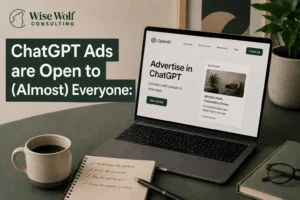 Laptop displaying a ChatGPT advertising interface on a desk with marketing notes, coffee, and analytics reports.
